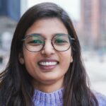 Happy Indian girl smiling on camera outdoor - Focus on face
